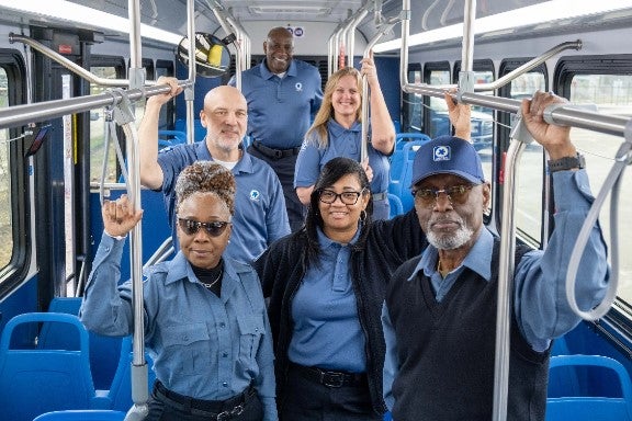 Metro operators inside a Metro bus.